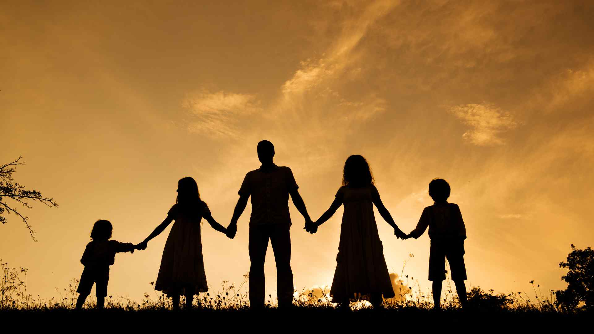 Family celebrating after finishing a fitness challenge outdoors