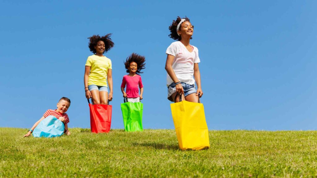 kid sack race in the backyard