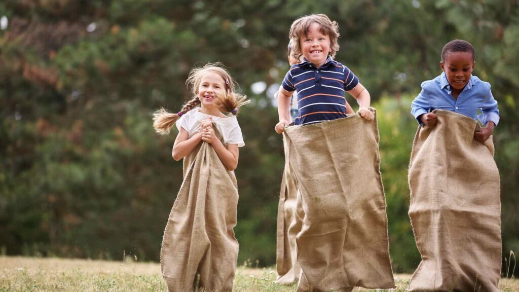 kid sack race in the backyard