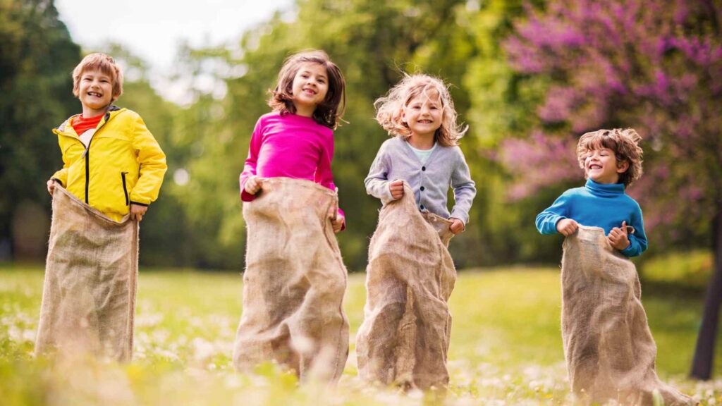 kid sack race in the backyard